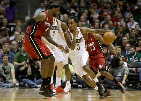LeBron James, left, expresses dissatisfaction with the NBA's Defensive Player of the Year voting. (Mike McGinnis/Getty Images)
